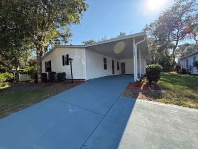 This 1560 square foot home has a unique very spacious floor on Whisperwood Golf Course in Florida - for sale on GolfHomes.com, golf home, golf lot