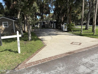 Enjoy resort-style living on this beautifully shaded RV lot with on The Great Outdoors Golf and Country Club in Florida - for sale on GolfHomes.com, golf home, golf lot