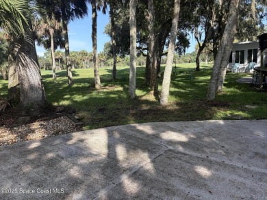 Enjoy resort-style living on this beautifully shaded RV lot with on The Great Outdoors Golf and Country Club in Florida - for sale on GolfHomes.com, golf home, golf lot
