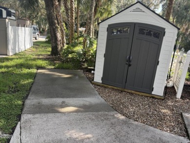Enjoy resort-style living on this beautifully shaded RV lot with on The Great Outdoors Golf and Country Club in Florida - for sale on GolfHomes.com, golf home, golf lot