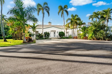 On a beautifully landscaped 1.26-acre lot, just across the on Gulf Stream Golf Club in Florida - for sale on GolfHomes.com, golf home, golf lot