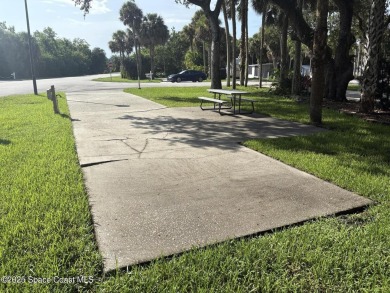 Enjoy resort-style living on this beautiful corner RV lot with on The Great Outdoors Golf and Country Club in Florida - for sale on GolfHomes.com, golf home, golf lot