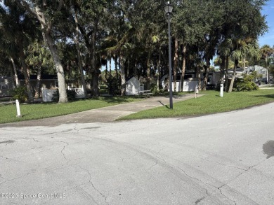 Enjoy resort-style living on this beautiful corner RV lot with on The Great Outdoors Golf and Country Club in Florida - for sale on GolfHomes.com, golf home, golf lot