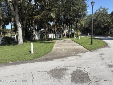 Enjoy resort-style living on this beautiful corner RV lot with on The Great Outdoors Golf and Country Club in Florida - for sale on GolfHomes.com, golf home, golf lot