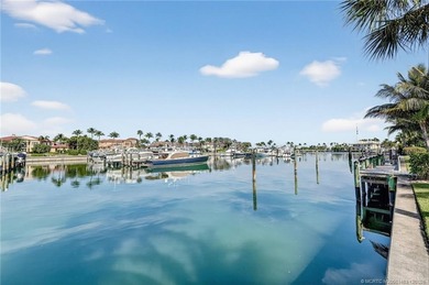 Set on a rare double lot in the prestigious, gated enclave of on Sailfish Point Golf Club, Inc. in Florida - for sale on GolfHomes.com, golf home, golf lot