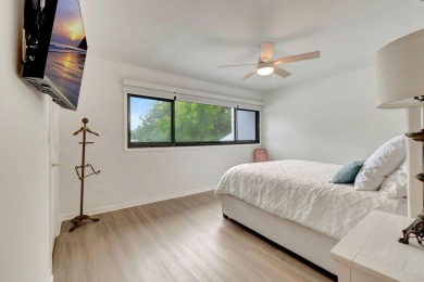 Captivating lakefront and golf views await in this spacious on Boca West Golf and Country Club in Florida - for sale on GolfHomes.com, golf home, golf lot