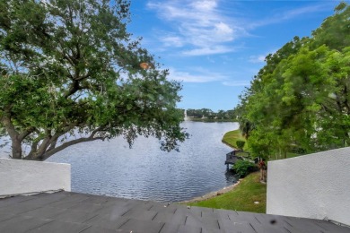 Captivating lakefront and golf views await in this spacious on Boca West Golf and Country Club in Florida - for sale on GolfHomes.com, golf home, golf lot