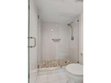 Captivating lakefront and golf views await in this spacious on Boca West Golf and Country Club in Florida - for sale on GolfHomes.com, golf home, golf lot