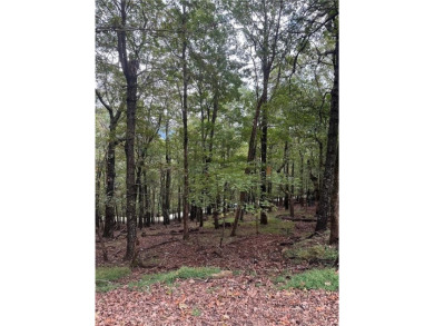 This .96 acre lot slopes gently down and should have a good view on Bent Tree Golf Course in Georgia - for sale on GolfHomes.com, golf home, golf lot