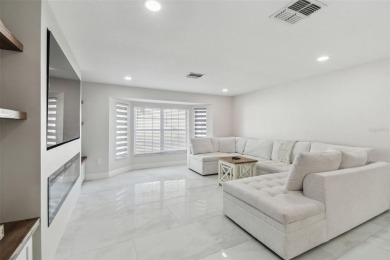 This simply amazing home has been completely remodeled with on Spring Hill Golf Course in Florida - for sale on GolfHomes.com, golf home, golf lot