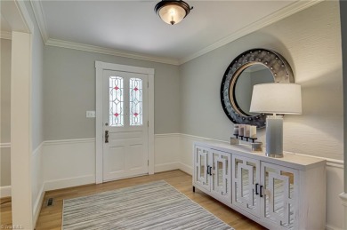 Classic white brick beauty nestled on the 16th fairway of Forest on Forest Oaks Country Club in North Carolina - for sale on GolfHomes.com, golf home, golf lot