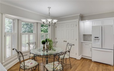 Classic white brick beauty nestled on the 16th fairway of Forest on Forest Oaks Country Club in North Carolina - for sale on GolfHomes.com, golf home, golf lot