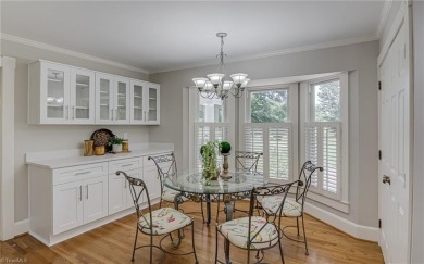 Classic white brick beauty nestled on the 16th fairway of Forest on Forest Oaks Country Club in North Carolina - for sale on GolfHomes.com, golf home, golf lot