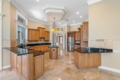 This custom designed 4 bed / 4 bath / 3 car garage home is on Bayou Golf Club in Florida - for sale on GolfHomes.com, golf home, golf lot