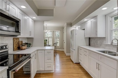 Classic white brick beauty nestled on the 16th fairway of Forest on Forest Oaks Country Club in North Carolina - for sale on GolfHomes.com, golf home, golf lot