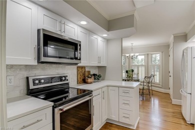 Classic white brick beauty nestled on the 16th fairway of Forest on Forest Oaks Country Club in North Carolina - for sale on GolfHomes.com, golf home, golf lot