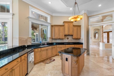 This custom designed 4 bed / 4 bath / 3 car garage home is on Bayou Golf Club in Florida - for sale on GolfHomes.com, golf home, golf lot