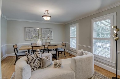 Classic white brick beauty nestled on the 16th fairway of Forest on Forest Oaks Country Club in North Carolina - for sale on GolfHomes.com, golf home, golf lot