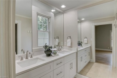 Classic white brick beauty nestled on the 16th fairway of Forest on Forest Oaks Country Club in North Carolina - for sale on GolfHomes.com, golf home, golf lot