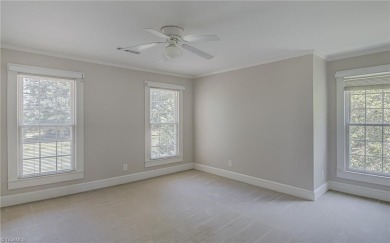 Classic white brick beauty nestled on the 16th fairway of Forest on Forest Oaks Country Club in North Carolina - for sale on GolfHomes.com, golf home, golf lot