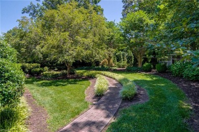 Classic white brick beauty nestled on the 16th fairway of Forest on Forest Oaks Country Club in North Carolina - for sale on GolfHomes.com, golf home, golf lot
