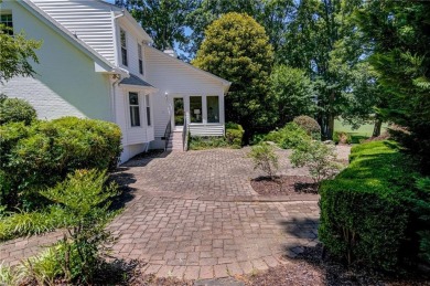 Classic white brick beauty nestled on the 16th fairway of Forest on Forest Oaks Country Club in North Carolina - for sale on GolfHomes.com, golf home, golf lot