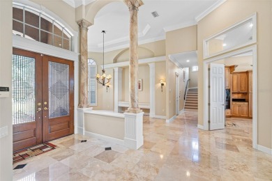 This custom designed 4 bed / 4 bath / 3 car garage home is on Bayou Golf Club in Florida - for sale on GolfHomes.com, golf home, golf lot