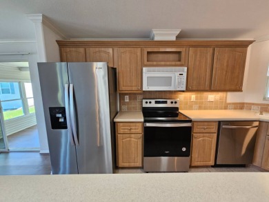 Some pictures have been virtually staged. This home is on leased on Big Cypress Golf and Country Club in Florida - for sale on GolfHomes.com, golf home, golf lot