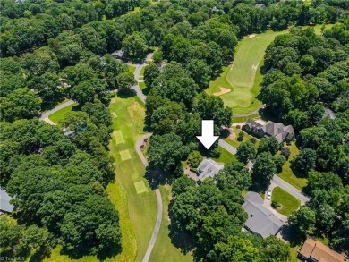 Classic white brick beauty nestled on the 16th fairway of Forest on Forest Oaks Country Club in North Carolina - for sale on GolfHomes.com, golf home, golf lot