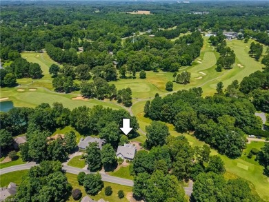 Classic white brick beauty nestled on the 16th fairway of Forest on Forest Oaks Country Club in North Carolina - for sale on GolfHomes.com, golf home, golf lot