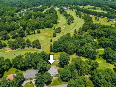 Classic white brick beauty nestled on the 16th fairway of Forest on Forest Oaks Country Club in North Carolina - for sale on GolfHomes.com, golf home, golf lot