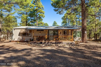 Nestled in Show Low's charming Fairway Park, this inviting on Bison Golf and Country Club in Arizona - for sale on GolfHomes.com, golf home, golf lot