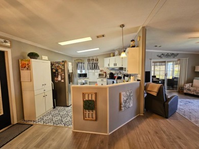 This home is in a 55+ resort-style manufactured home community on Big Cypress Golf and Country Club in Florida - for sale on GolfHomes.com, golf home, golf lot