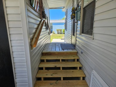 This home is in a 55+ resort-style manufactured home community on Big Cypress Golf and Country Club in Florida - for sale on GolfHomes.com, golf home, golf lot