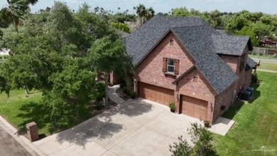 Experience serene pond-side living in this expertly crafted home on Harlingen Country Club in Texas - for sale on GolfHomes.com, golf home, golf lot