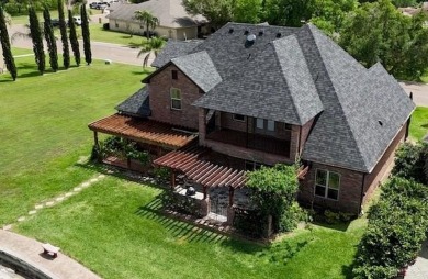 Experience serene pond-side living in this expertly crafted home on Harlingen Country Club in Texas - for sale on GolfHomes.com, golf home, golf lot