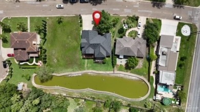 Experience serene pond-side living in this expertly crafted home on Harlingen Country Club in Texas - for sale on GolfHomes.com, golf home, golf lot