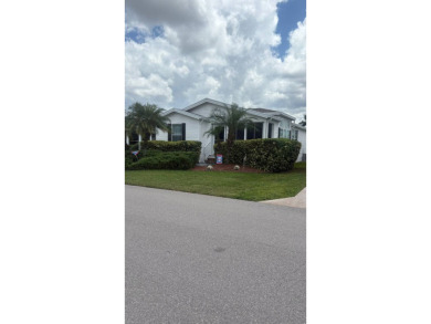 Spacious 3-Bedroom Palm Harbor with Golf Cart in 55+ on Sabal Springs Golf and Racquet Club in Florida - for sale on GolfHomes.com, golf home, golf lot