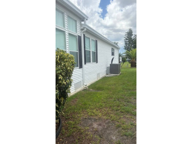 Spacious 3-Bedroom Palm Harbor with Golf Cart in 55+ on Sabal Springs Golf and Racquet Club in Florida - for sale on GolfHomes.com, golf home, golf lot