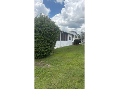 Spacious 3-Bedroom Palm Harbor with Golf Cart in 55+ on Sabal Springs Golf and Racquet Club in Florida - for sale on GolfHomes.com, golf home, golf lot