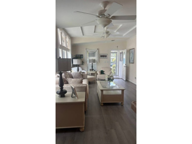 Spacious 3-Bedroom Palm Harbor with Golf Cart in 55+ on Sabal Springs Golf and Racquet Club in Florida - for sale on GolfHomes.com, golf home, golf lot