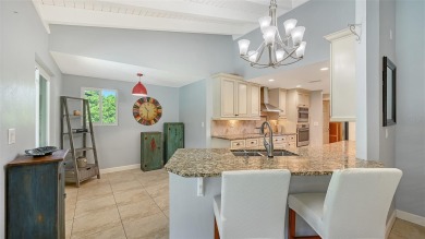 This property offers an ASSUMABLE VA loan for qualified buyers! on Sorrento Par 3 in Florida - for sale on GolfHomes.com, golf home, golf lot