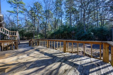 Beautiful home nestled in a private cove with abundance of trees on Holly Lake Ranch Golf Club in Texas - for sale on GolfHomes.com, golf home, golf lot