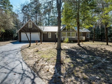 Beautiful home nestled in a private cove with abundance of trees on Holly Lake Ranch Golf Club in Texas - for sale on GolfHomes.com, golf home, golf lot