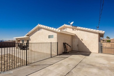 This inviting south-side home features an open concept living on London Bridge Golf Course in Arizona - for sale on GolfHomes.com, golf home, golf lot
