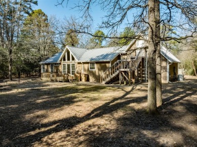 Beautiful home nestled in a private cove with abundance of trees on Holly Lake Ranch Golf Club in Texas - for sale on GolfHomes.com, golf home, golf lot