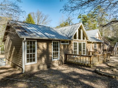 Beautiful home nestled in a private cove with abundance of trees on Holly Lake Ranch Golf Club in Texas - for sale on GolfHomes.com, golf home, golf lot