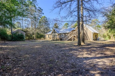 Beautiful home nestled in a private cove with abundance of trees on Holly Lake Ranch Golf Club in Texas - for sale on GolfHomes.com, golf home, golf lot