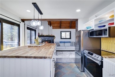 This 3 bed two bath fully remodeled home sits in an Amenity on Pocono Farms Country Club in Pennsylvania - for sale on GolfHomes.com, golf home, golf lot
