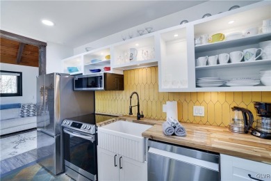 This 3 bed two bath fully remodeled home sits in an Amenity on Pocono Farms Country Club in Pennsylvania - for sale on GolfHomes.com, golf home, golf lot